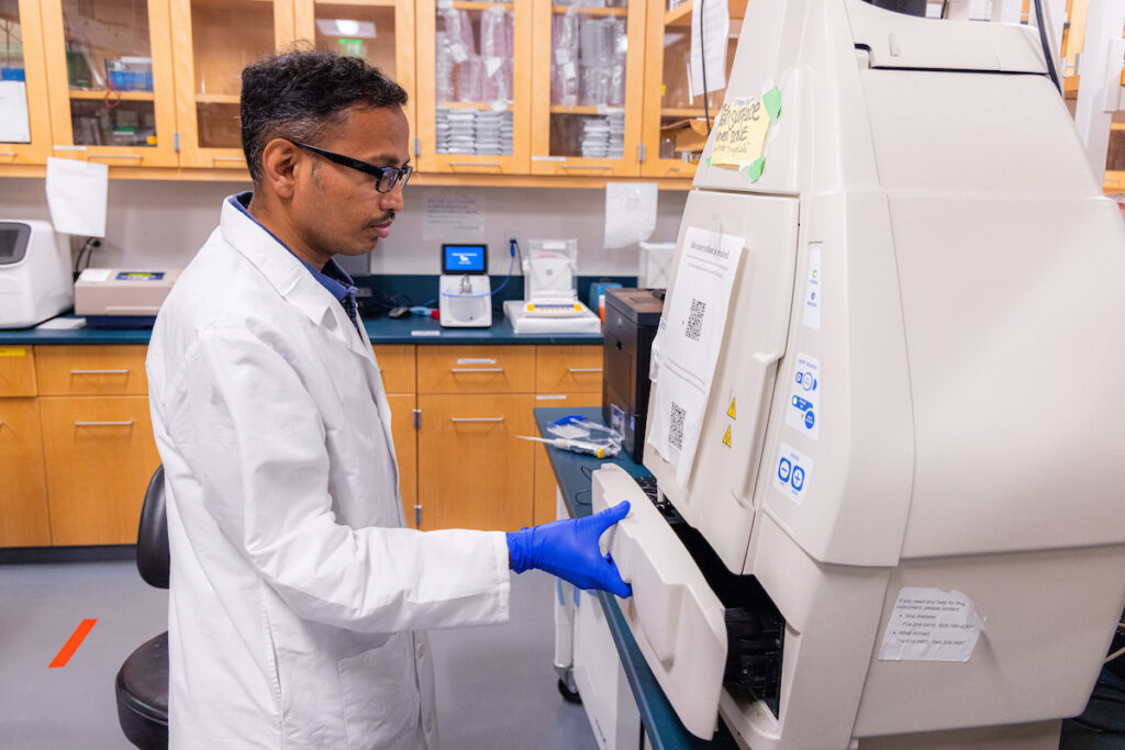 Technician in pharmacy lab.